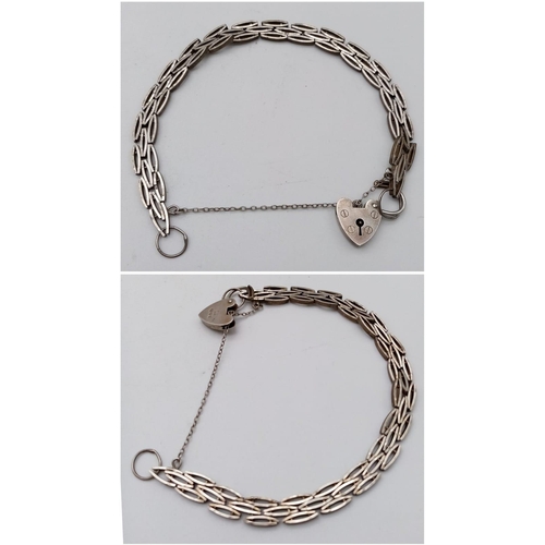 1772 - A Parcel of Sterling Silver Jewellery.
Consisting of a unique oval chain, love heart lock bracelet (... 