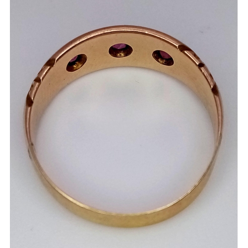 671 - An Antique 22K Yellow Gold and Ruby Ring. Three round cut rubies. Size O. 3.07g total weight.