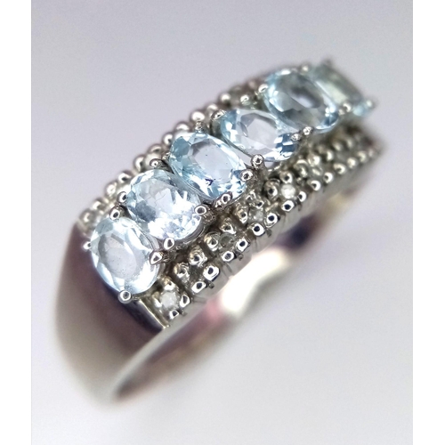 709 - 9kt White Gold Ring, set with 6 Oval Cut Aquamarine and Diamonds. 
Comes with box.
Size: X
Weight: 4... 