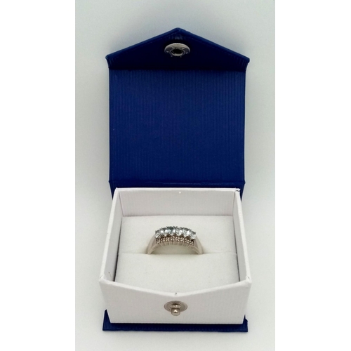 709 - 9kt White Gold Ring, set with 6 Oval Cut Aquamarine and Diamonds. 
Comes with box.
Size: X
Weight: 4... 