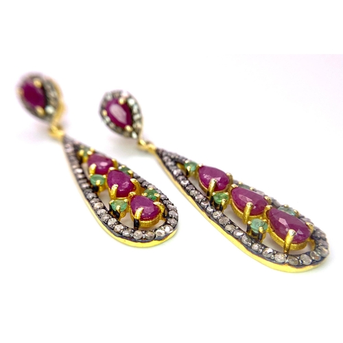 1044 - A Pair of Ruby, Emerald and Diamond Teardrop Earrings. Emeralds and rubies - 4.65ctw. Diamonds- 1.10... 