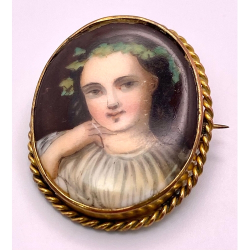 1346 - An Antique (possibly French) Gold and Hand-Painted Porcelain Portrait Brooch. 4cm. 9.05g total weigh... 