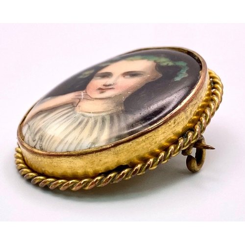 1346 - An Antique (possibly French) Gold and Hand-Painted Porcelain Portrait Brooch. 4cm. 9.05g total weigh... 