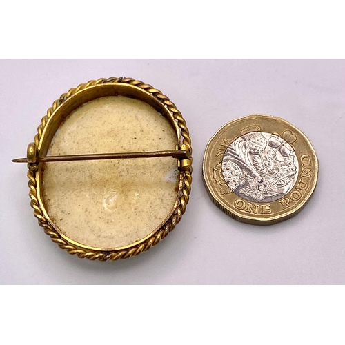 1346 - An Antique (possibly French) Gold and Hand-Painted Porcelain Portrait Brooch. 4cm. 9.05g total weigh... 