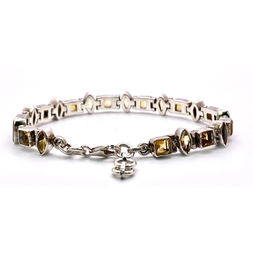 1578 - Sterling Silver Multi-Set Marquise & Princess-Cut Citrine Bracelet.
Measures 20cm in length.
Weight:... 