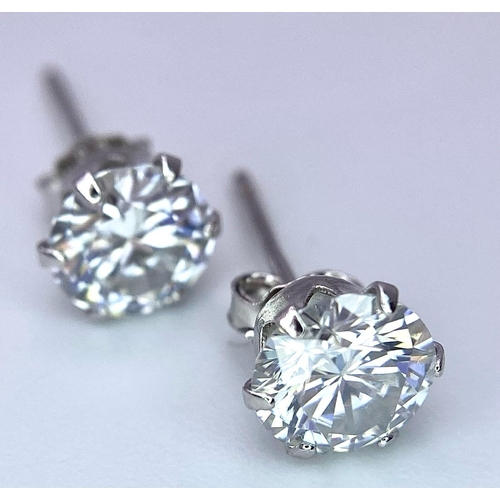 1587 - A pair of Sterling Silver, 0.5tcw Moissanite Stud Earrings.
Weight: 0.72g