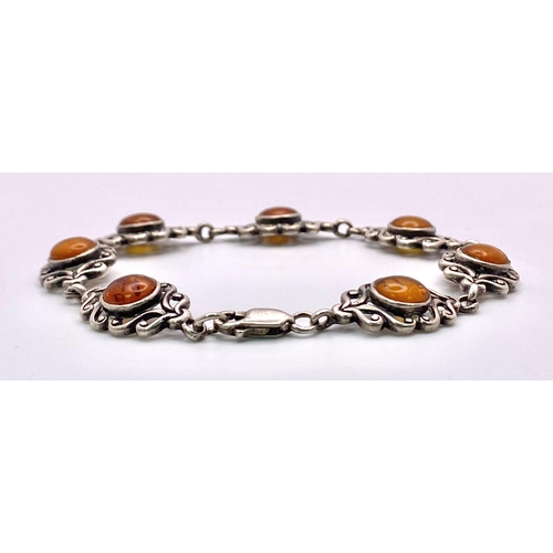 1616 - A parcel of Sterling Silver Jewellery.
Featuring an amber stone bracelet (20cm) and a purple stone r... 