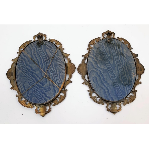 1693 - A pair of very old stain artworks in oval metal frames. Made in Italy, this pair is quite unique and... 