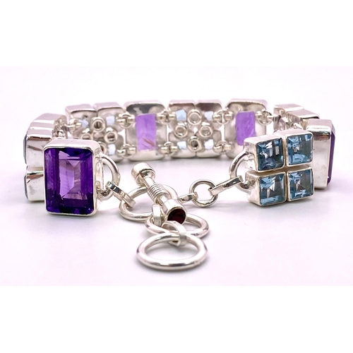 211 - A Unique, Futuristic, Amethyst and Blue Topaz Gemstone Bracelet set in 925 Silver. Ice blue squares ... 