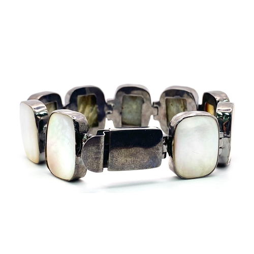 827 - A Vintage Style Mother of Pearl and 925 Silver Bracelet. Rectangular slices of MoP set in brushed si... 