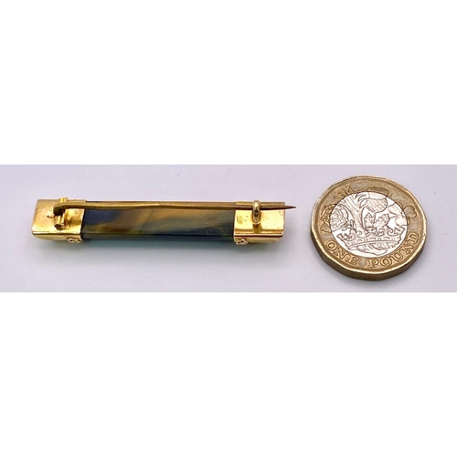 892 - A Hypnotic Antique 15K Gold Bar Brooch with Colour Change Tigers Eye. 5cm. 6.68g total weight.