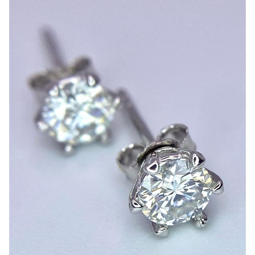 1399 - A pair of Sterling Silver, 1.0tcw Moissanite Stud Earrings.
Weight: 0.94g