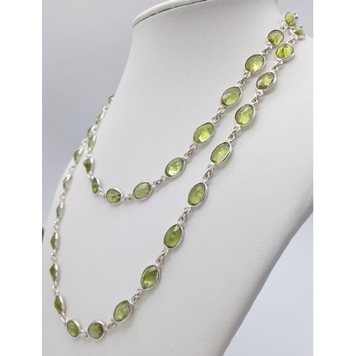 619 - An Oval Cut Peridot Gemstone Chain Necklace set in 925 Silver. 80cm. Ref: CD - 976.