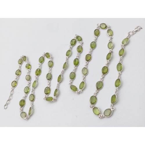 619 - An Oval Cut Peridot Gemstone Chain Necklace set in 925 Silver. 80cm. Ref: CD - 976.