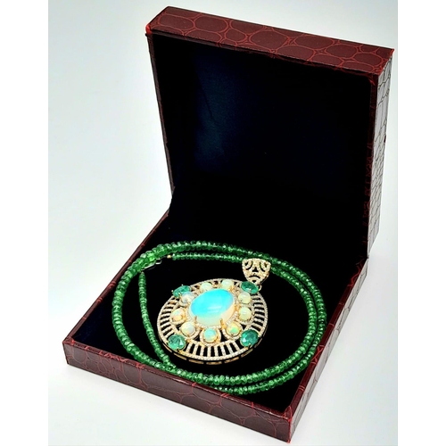 72 - A Fancy Opal, Diamond and Emerald Pendant with a Detachable Green Garnet Necklace. Centre opal with ... 