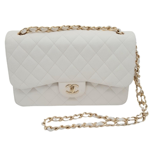 738 - Chanel Caviar Jumbo Single Flap Bag.
Quilted white caviar leather stitched in diamond pattern. Gold ... 