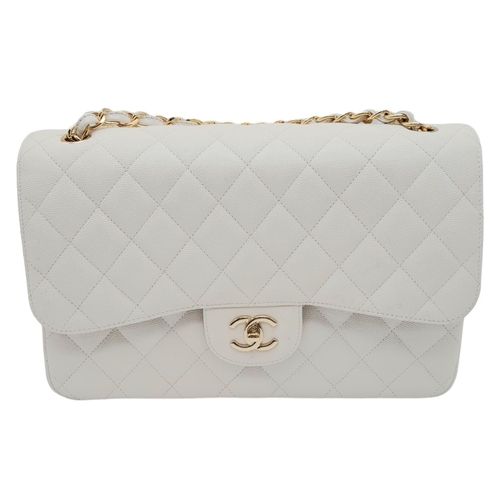 738 - Chanel Caviar Jumbo Single Flap Bag.
Quilted white caviar leather stitched in diamond pattern. Gold ... 