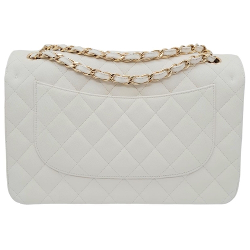 738 - Chanel Caviar Jumbo Single Flap Bag.
Quilted white caviar leather stitched in diamond pattern. Gold ... 