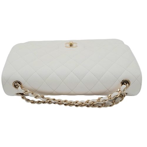 738 - Chanel Caviar Jumbo Single Flap Bag.
Quilted white caviar leather stitched in diamond pattern. Gold ... 