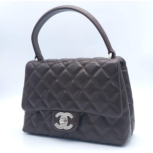 773 - Chanel Flap Bag with Handle.
Quality Lambskin leather, Diamond stitching with Silver tone hardware. ... 