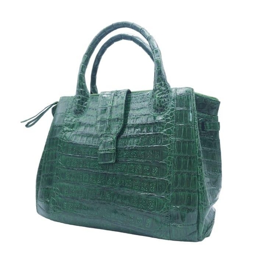 969 - Nancy Gonzalez Crocodile Handbag.
Rich, emerald green crocodile leather exterior with gold tone hard... 