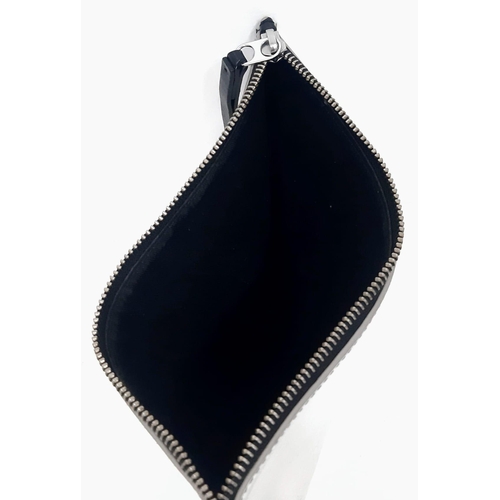 1026 - KENZO Reflective Sleeve Pouch.
Zip top with a large black leather zipper tag. Measures 24cm wide by ... 