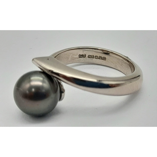 1629 - An 18K Gold (Rhodium Plated) South Sea Pearl Crossover Ring. Size N. 8.27g total weight. 10mm pearl.... 