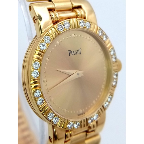 717 - A STUNNING PIAGET 18K GOLD LADIES DRESS WATCH WITH DIAMOND BEZEL , QUARTZ MOVEMENT . GOLDTONE DIAL A... 