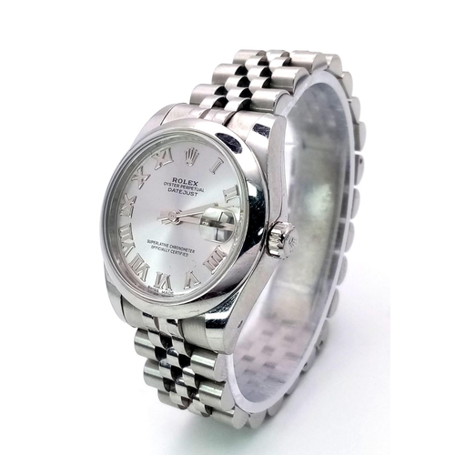 598 - A MID SIZE ROLEX PERPETUAL DATEJUST IN STAINLESS STEEL WITH SILVERTONE DIAL AND ROMAN NUMERALS .   3... 