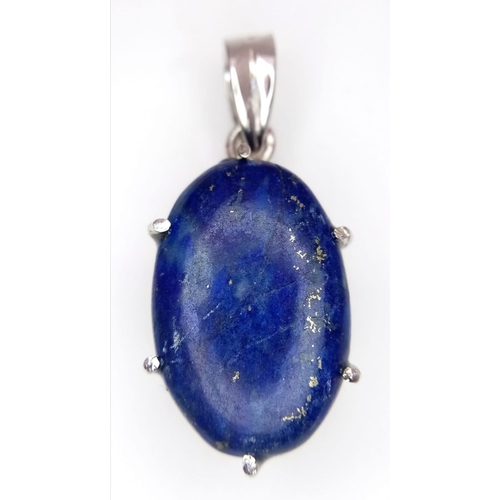 1093 - A Lapis Lazuli Cabochon 925 Silver Pendant. Oval stone on a raised foundation. 3.5cm. 8.56g total we... 