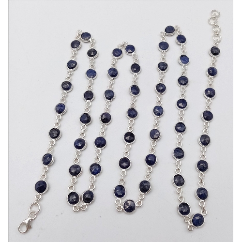 1323 - A Round Cut Blue Sapphire Gemstone Chain Necklace set in 925 Silver. 74cm length. 23.6g weight. Ref:... 