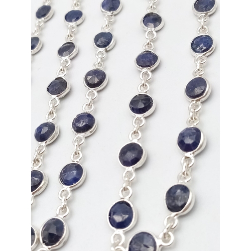 1323 - A Round Cut Blue Sapphire Gemstone Chain Necklace set in 925 Silver. 74cm length. 23.6g weight. Ref:... 