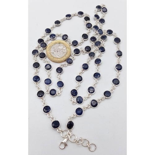 1323 - A Round Cut Blue Sapphire Gemstone Chain Necklace set in 925 Silver. 74cm length. 23.6g weight. Ref:... 