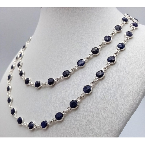 1323 - A Round Cut Blue Sapphire Gemstone Chain Necklace set in 925 Silver. 74cm length. 23.6g weight. Ref:... 