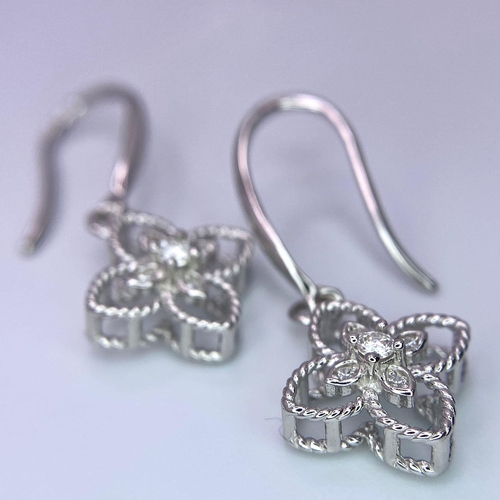 1378 - A pair of Sterling Silver Floral Design, 0.5tcw Moissanite Earrings.
Weight: 2.05g