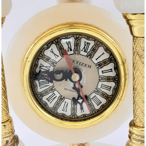 1608 - A Vintage White Onyx Mantle Clock.
Featuring three pillars, gold tone metal and elaborate patterning... 