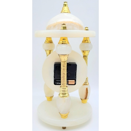 1608 - A Vintage White Onyx Mantle Clock.
Featuring three pillars, gold tone metal and elaborate patterning... 