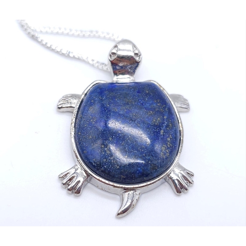 1720 - A Lapis Lazuli Turtle Pendant on a White Metal Necklace. 4cm and 46cm.