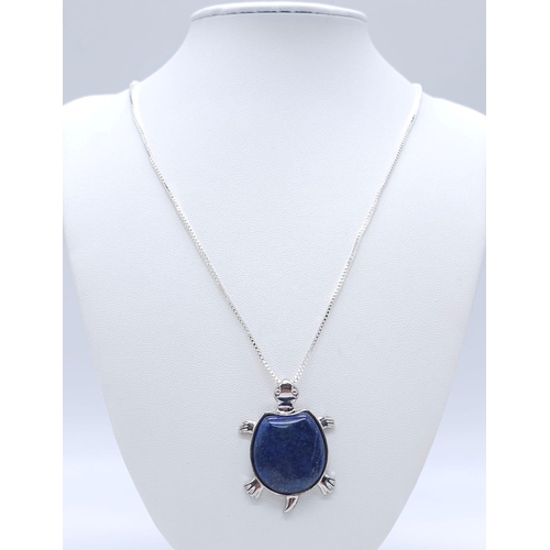 1720 - A Lapis Lazuli Turtle Pendant on a White Metal Necklace. 4cm and 46cm.