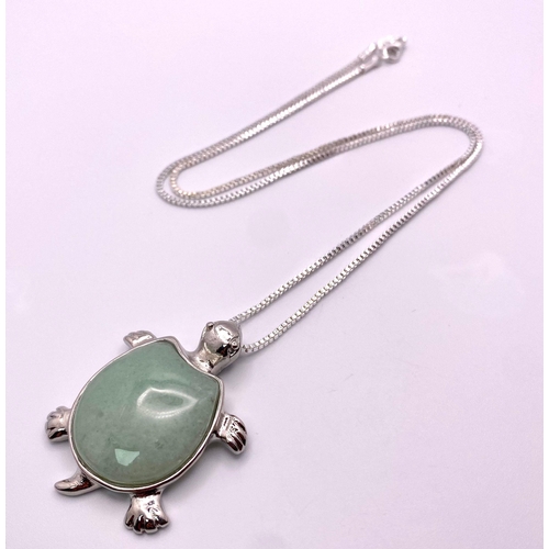 1749 - A Green Jade Turtle Pendant on a White Metal Necklace. 4cm and 44cm.