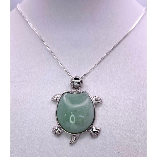 1749 - A Green Jade Turtle Pendant on a White Metal Necklace. 4cm and 44cm.