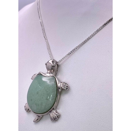 1749 - A Green Jade Turtle Pendant on a White Metal Necklace. 4cm and 44cm.