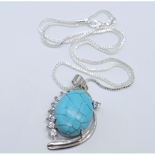 1763 - A Blue Turquoise Pendant on a White Metal Necklace. 4cm and 46cm.