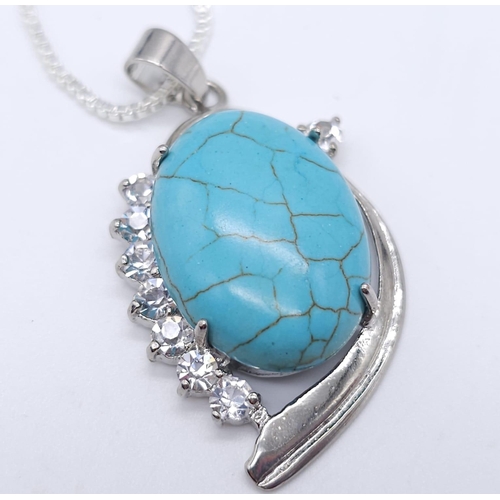 1763 - A Blue Turquoise Pendant on a White Metal Necklace. 4cm and 46cm.