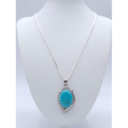 1763 - A Blue Turquoise Pendant on a White Metal Necklace. 4cm and 46cm.