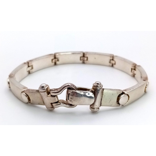 189 - A very fashionable, sterling silver, unisex bracelet by the renowned jeweller LESLIE DAVIES-Jeweller... 