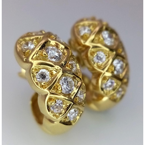 260 - A Pair of 18K Yellow Gold and Diamond Wrap-Around Earrings. Beautifully constructed - each with 10 r... 