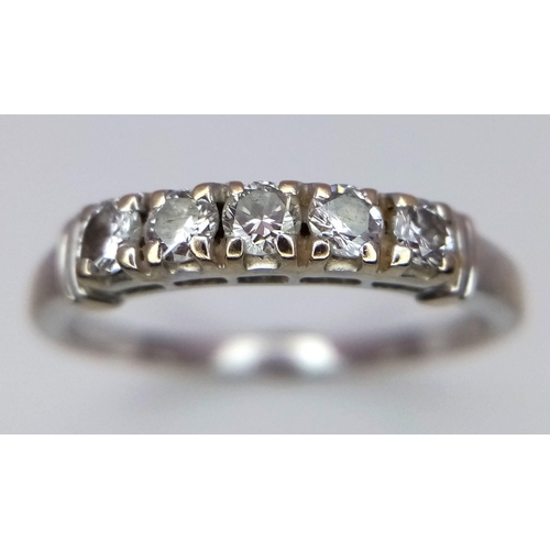 296 - AN 18K WHITE GOLD RING WITH 5 QUALITY DIAMOND STONES .   3.2gms   size R