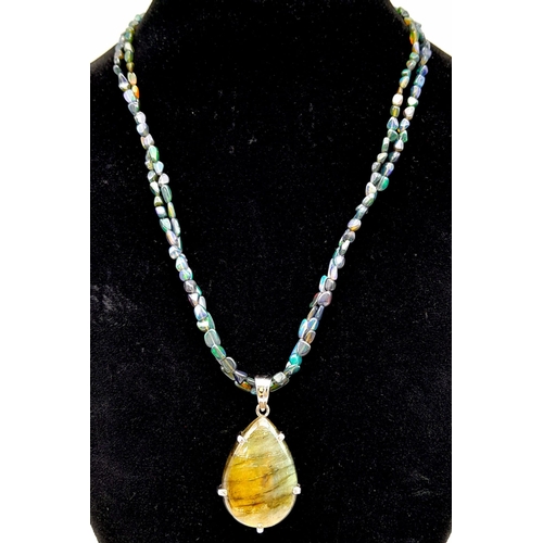 540 - A Labradorite Pendant on a Two-Row  Opal bead Necklace. Finished with a colour-play opal and diamond... 