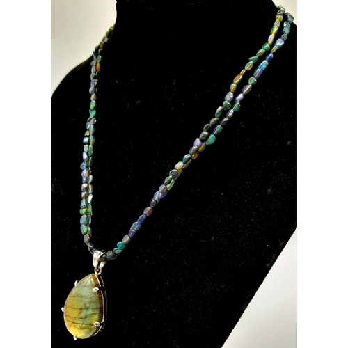 540 - A Labradorite Pendant on a Two-Row  Opal bead Necklace. Finished with a colour-play opal and diamond... 